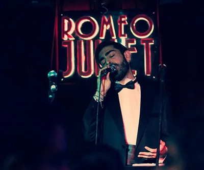 Ferhat Öz singing at a jazz club